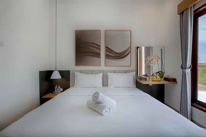 Imagen de la habitación del Hotel Taman Seminyak Suites. Foto 14