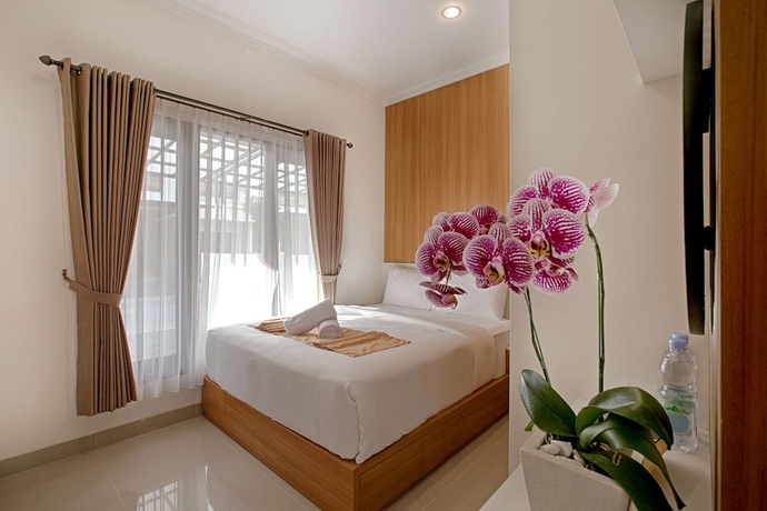 Imagen de la habitación del Hotel Taman Seminyak Suites. Foto 15