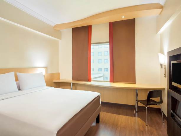 Imagen de la habitación del Hotel Tamarin Jakarta. Foto 5