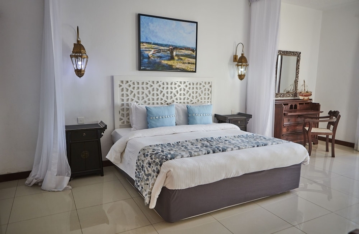 Imagen de la habitación del Hotel Tamarind Village Apartments. Foto 3