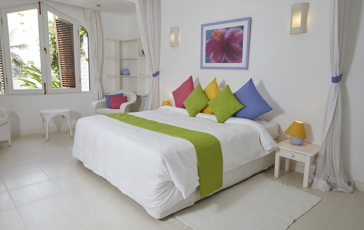 Imagen de la habitación del Hotel Tamarind Village Apartments. Foto 5