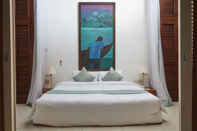 Imagen de la habitación del Hotel Tamarind Village Apartments. Foto 10