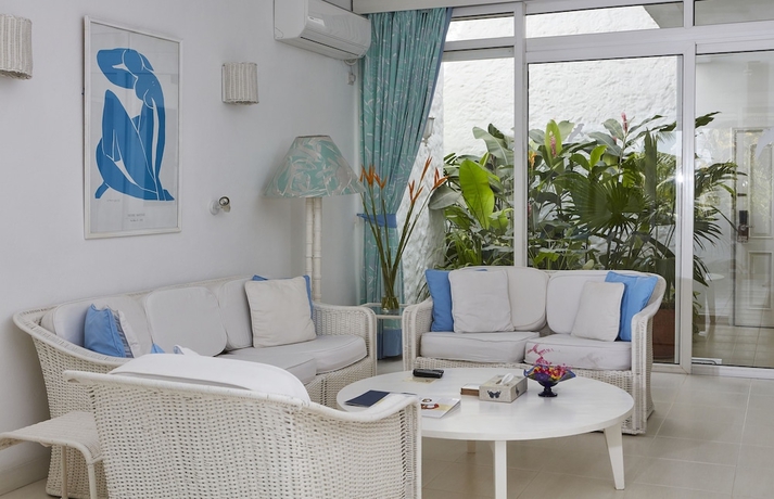 Imagen de la habitación del Hotel Tamarind Village Apartments. Foto 13