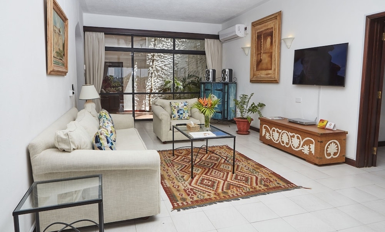 Imagen de la habitación del Hotel Tamarind Village Apartments. Foto 18