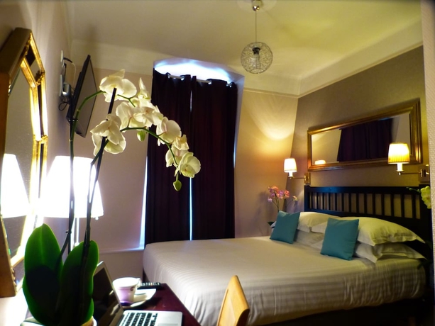 Imagen de la habitación del Hotel Tamaris, París. Foto 14