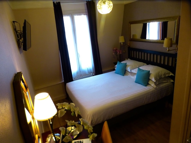 Imagen de la habitación del Hotel Tamaris, París. Foto 15