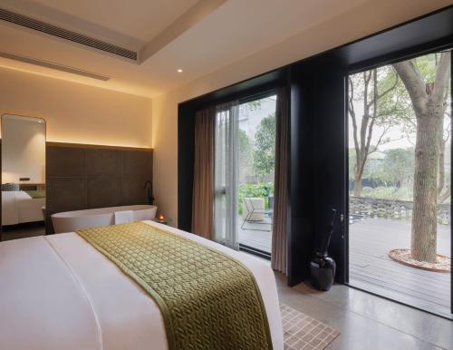 Imagen de la habitación del Hotel Tan Alley Wuzhen Eco and Cultural Community. Foto 20