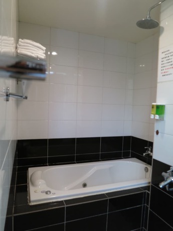 Imagen de la habitación del Hotel Tan Hui. Foto 18