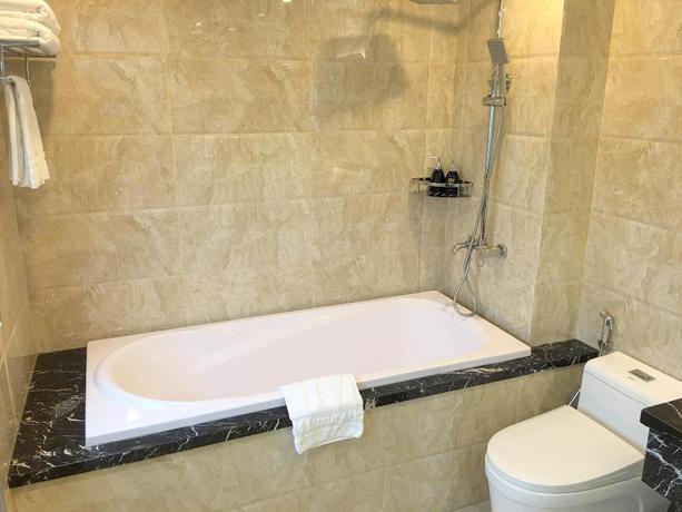 Imagen de la habitación del Hotel Tandm Luxury Hanoi. Foto 15