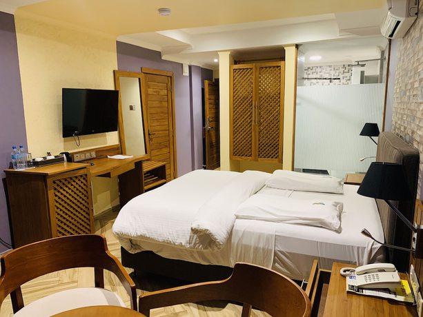 Imagen de la habitación del Hotel Tanga Beach Resort And Spa. Foto 8