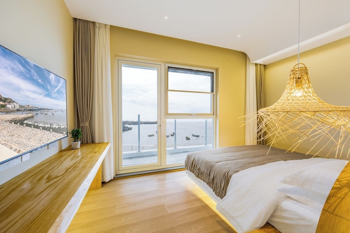 Imagen de la habitación del Hotel Tangchi Seaview Resort. Foto 6