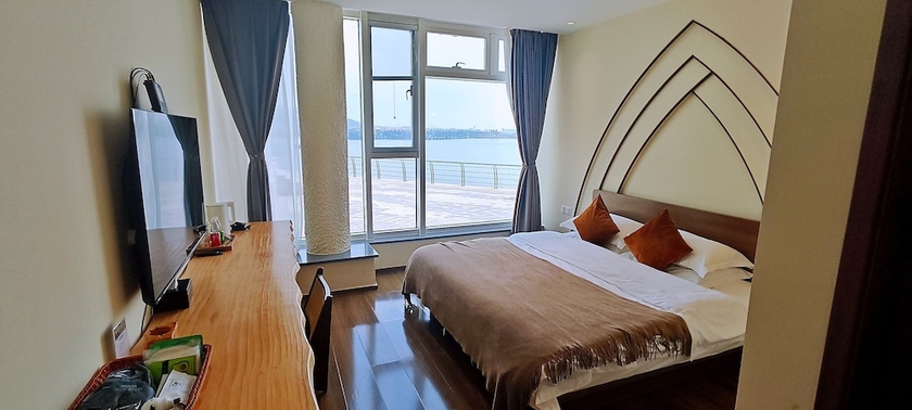 Imagen de la habitación del Hotel Tangchi Seaview Resort. Foto 9