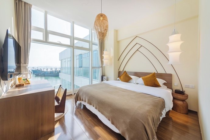 Imagen de la habitación del Hotel Tangchi Seaview Resort. Foto 11