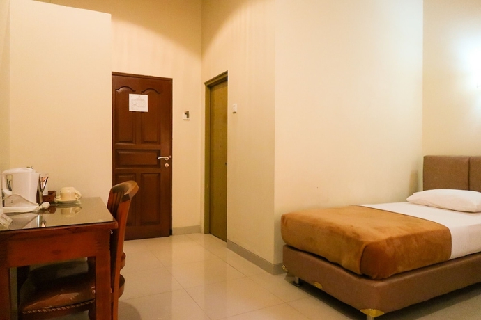 Imagen de la habitación del Hotel Tangko Inn Resort. Foto 15