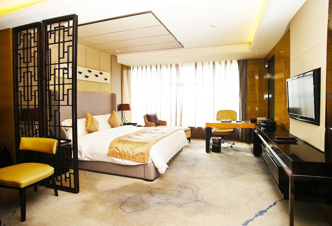 Imagen de la habitación del Hotel Tangla Tianjin. Foto 2