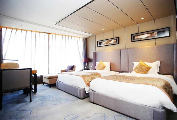 Imagen de la habitación del Hotel Tangla Tianjin. Foto 4