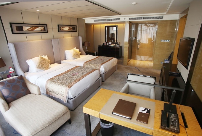 Imagen de la habitación del Hotel Tangla Tianjin. Foto 10