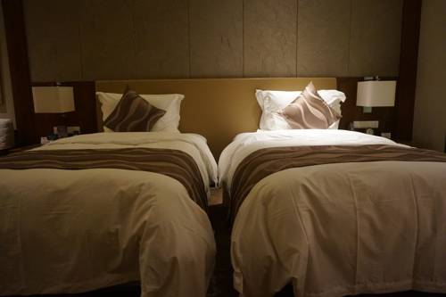 Imagen de la habitación del Hotel Tangram Harbin International Exhibition Cent. Foto 3