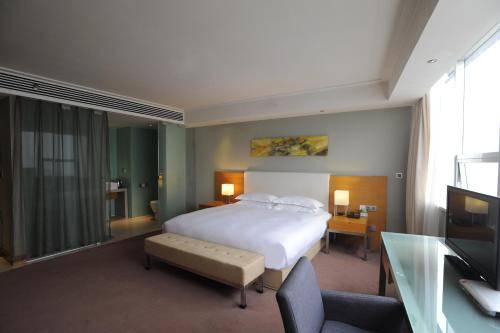 Imagen de la habitación del Hotel Tang's. Foto 10