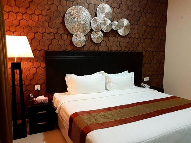 Imagen de la habitación del Hotel Tanuf Residency. Foto 11
