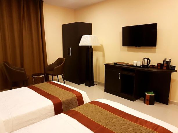 Imagen de la habitación del Hotel Tanuf Residency. Foto 12