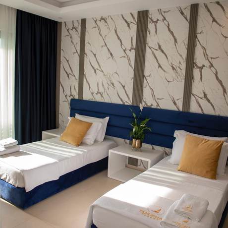 Imagen de la habitación del Hotel Tanushaj Beach Resort. Foto 13