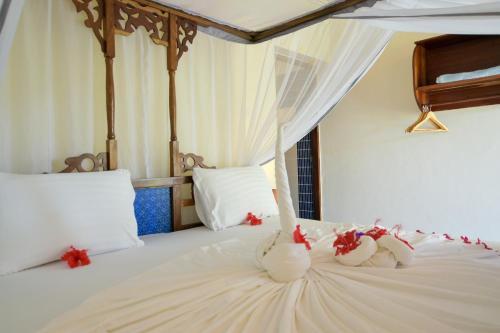 Imagen de la habitación del Hotel Tanzanite Beach Resort. Foto 6