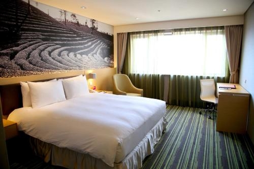 Imagen de la habitación del Hotel Tao Garden. Foto 10