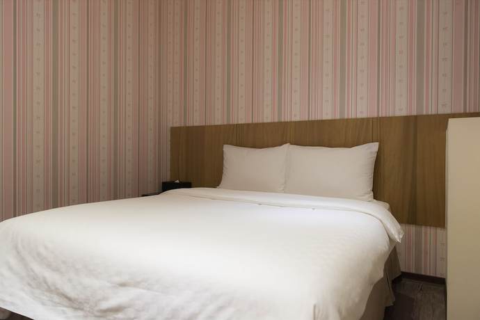 Imagen de la habitación del Hotel Taoyuan Hedo Hotel. Foto 4