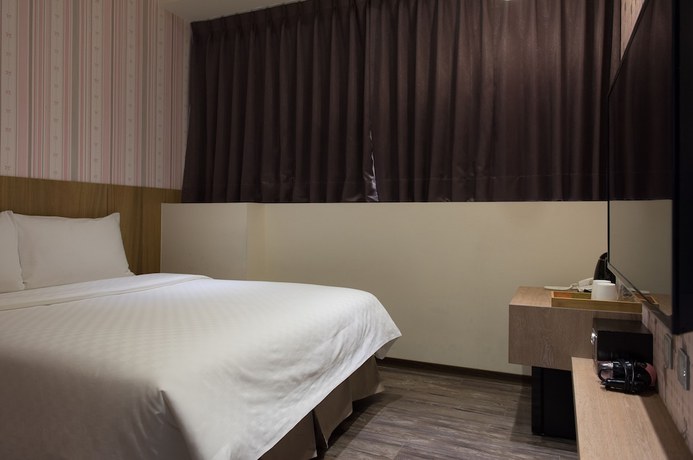 Imagen de la habitación del Hotel Taoyuan Hedo Hotel. Foto 16