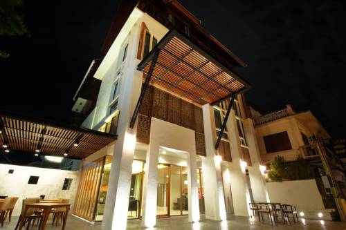 Imagen de la habitación del Hotel Tapae Gate Villa. Foto 2