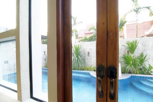 Imagen de la habitación del Hotel Tapae Gate Villa. Foto 10