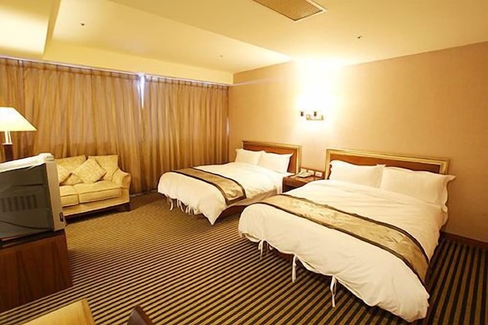 Imagen de la habitación del Hotel Tapeng Bay Holiday. Foto 21