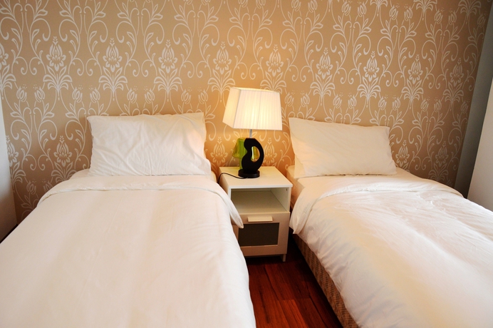 Imagen de la habitación del Hotel Taragon Residences. Foto 12
