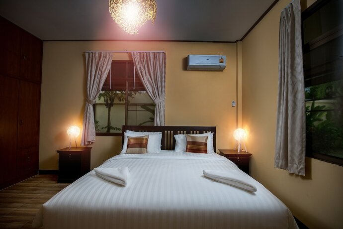 Imagen de la habitación del Hotel Taratai Villa. Foto 18