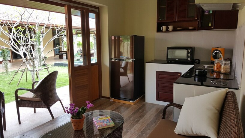 Imagen de la habitación del Hotel Taratai Villa. Foto 25