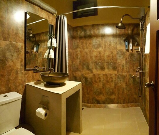 Imagen de la habitación del Hotel Taratai Villa. Foto 27