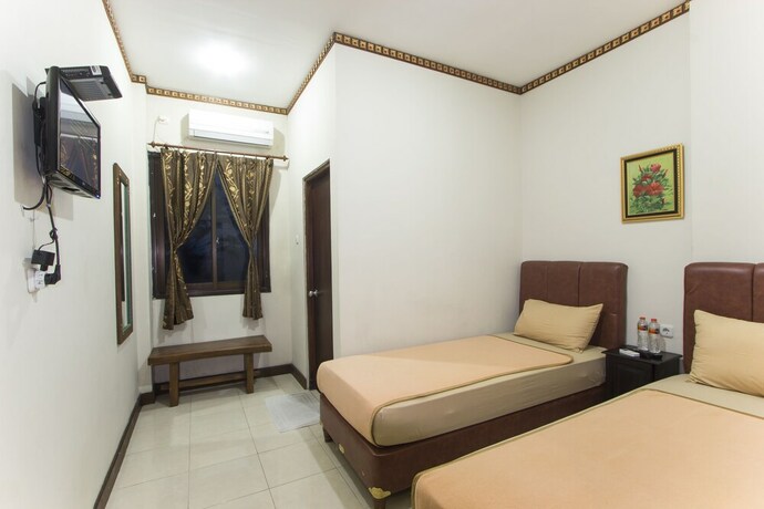 Imagen de la habitación del Hotel Tasik Jogja. Foto 8