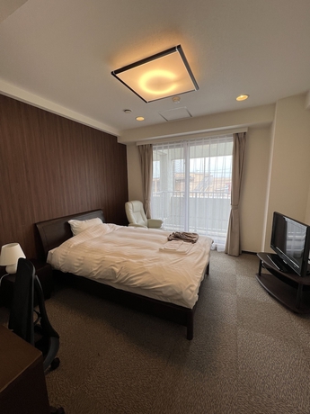 Imagen de la habitación del Hotel Tatsumi Club. Foto 12