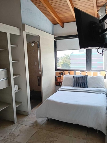 Imagen de la habitación del Hotel Tauro Black Suites. Foto 4