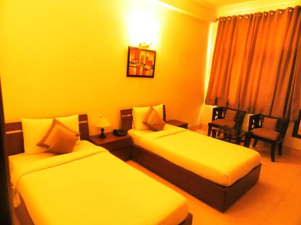 Imagen de la habitación del Hotel Tavisha Villa. Foto 9