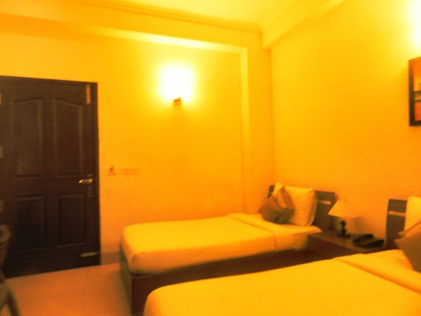 Imagen de la habitación del Hotel Tavisha Villa. Foto 12