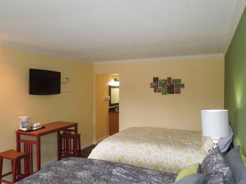 Imagen de la habitación del Hotel Tea Garden Lodge. Foto 5