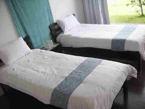 Imagen de la habitación del Hotel Tea Garden Resort. Foto 5