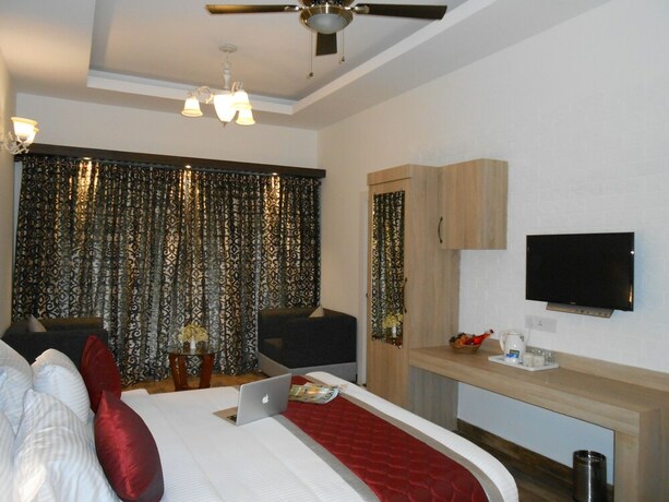 Imagen de la habitación del Hotel Tea Harvester Munnar. Foto 22