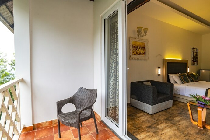 Imagen de la habitación del Hotel Tea Harvester Munnar. Foto 23