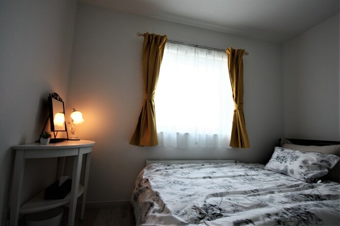 Imagen de la habitación del Hotel Teine White House. Foto 24