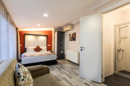 Imagen de la habitación del Hotel Tel Street Suites. Foto 19