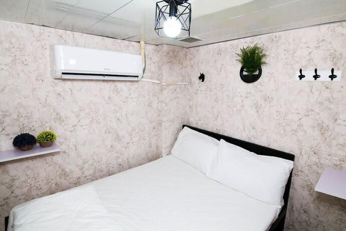 Imagen de la habitación del Hotel Tempo Inn - Cozy@national Court. Foto 19