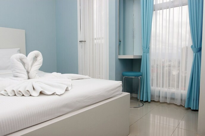 Imagen de la habitación del Hotel Ten Eleven Living Point. Foto 33
